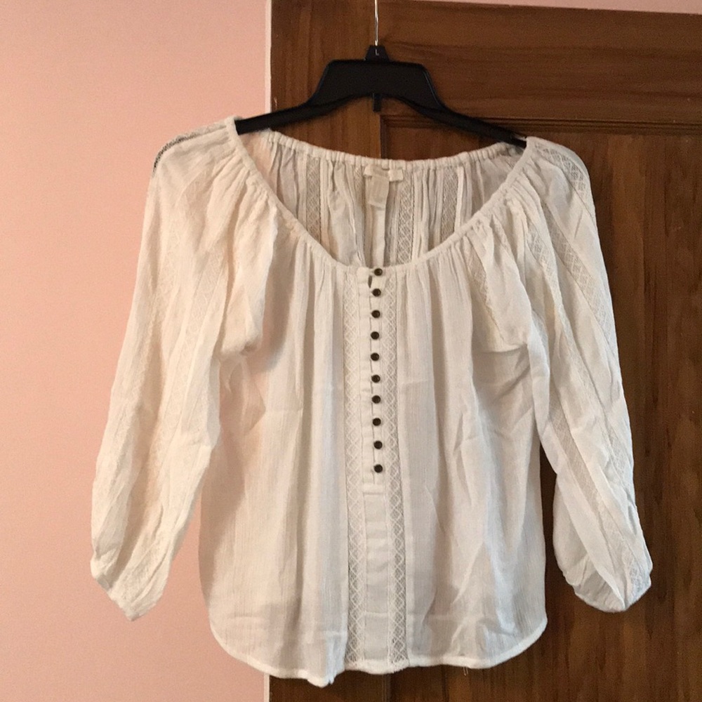 White long sleeved blouse with buttons